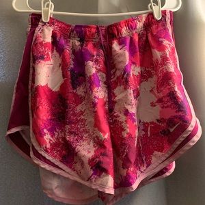 Pink patterned Nike athletic shorts